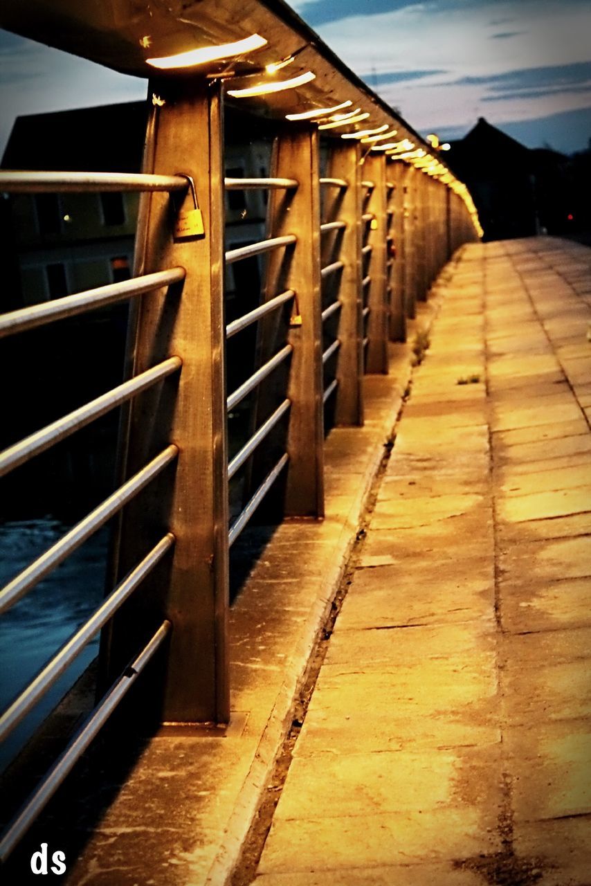 architecture, built structure, building exterior, the way forward, diminishing perspective, sky, building, city, vanishing point, railing, outdoors, no people, sunlight, day, residential structure, low angle view, shadow, wood - material, empty, residential building