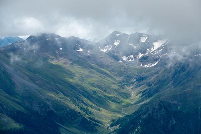 Aerial view of mountain range against sky