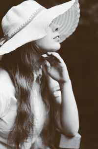 Side view of woman wearing hat