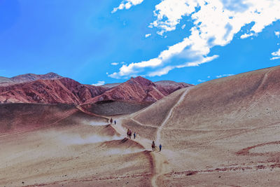 Scenic view of arid landscape against sky