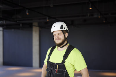 Smiling worker looking at camera