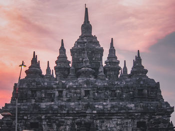 Historic building against sky at sunset