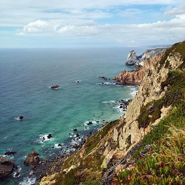 sea, water, horizon over water, tranquil scene, scenics, tranquility, sky, beauty in nature, nature, cliff, rock - object, coastline, idyllic, rock formation, mountain, day, high angle view, rock, beach, cloud - sky