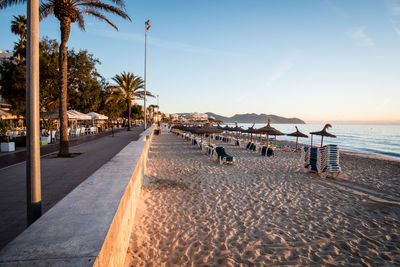 Scenic view of beach against sky during sunset