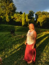 Full length of woman standing on field