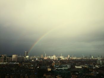 Rainbow over cityscape