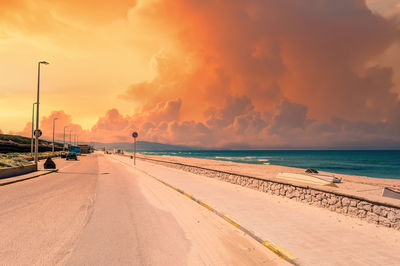 Scenic view of beach against sky during sunset