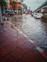 Wet sidewalk in city