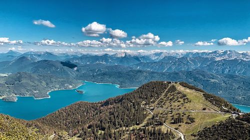 Aerial view of snowcapped mountain against cloudy sky