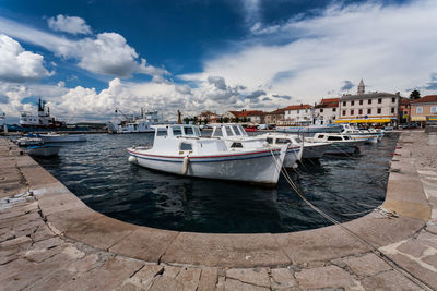 Boats moored at harbor