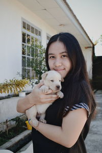 Portrait of woman with dog