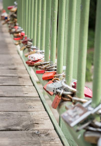 Close-up of padlocks on metal railing