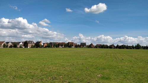 Panoramic shot of field against sky