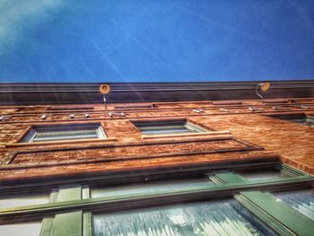 Low angle view of building against blue sky