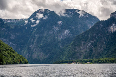 Scenic view of land and mountains against sky