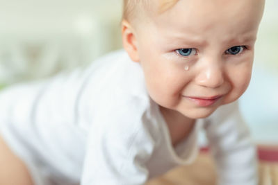 Portrait of cute baby boy crying