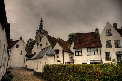 Panoramic view of houses and buildings against sky