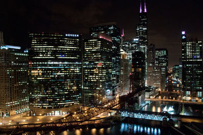 Illuminated cityscape at night