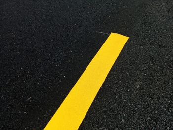 High angle view of arrow sign on road