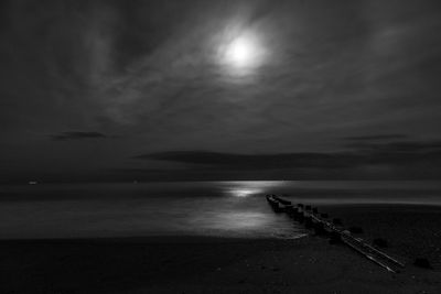 Scenic view of sea against sky at night