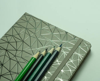 Close-up of pencils against white background