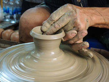 Close-up of man making pot