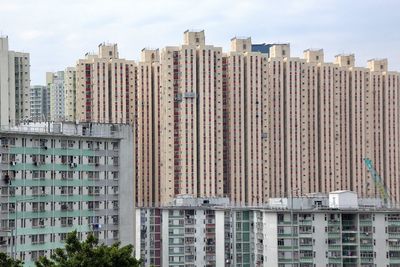 Different types of residential buildings under clear sky 