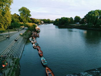 High angle view of river amidst trees against sky