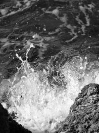 Close-up of waves splashing in sea