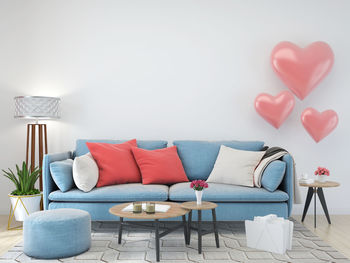 Empty chairs and table against wall at home