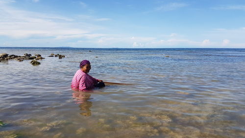 Girl swimming in sea