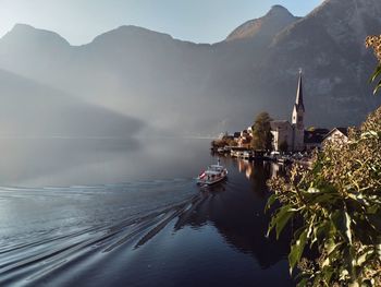 Panoramic view of sea and buildings against sky
