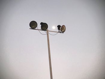 Low angle view of street light against clear sky