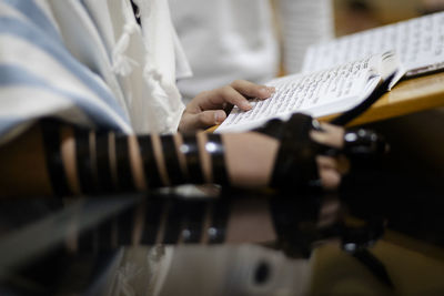 Midsection of man playing guitar