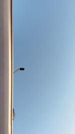 Low angle view of street light against clear sky