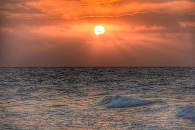 Scenic view of sea at sunset