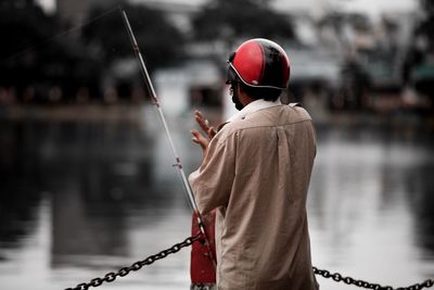 Man fishing in lake