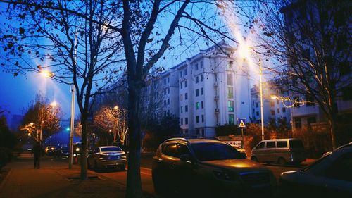 Cars on road in city at night