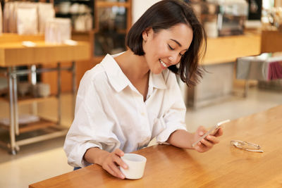 Businesswoman working at table