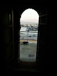 View of city seen through archway