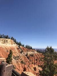Scenic view of mountains against clear blue sky