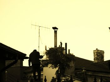 Low angle view of silhouette man against sky at sunset