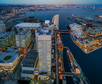 High angle view of illuminated buildings in city at dusk