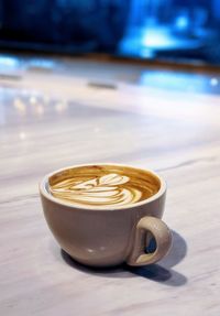 Close-up of cappuccino on table