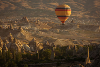 Hot air balloon flying over land