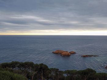 Scenic view of sea against sky at sunset