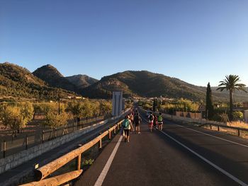 Empty road with mountains in background