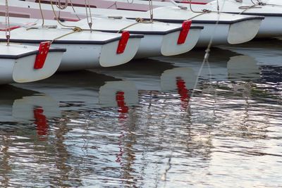 Close-up of boats moored in sea