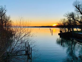 Scenic view of lake against sky during sunset