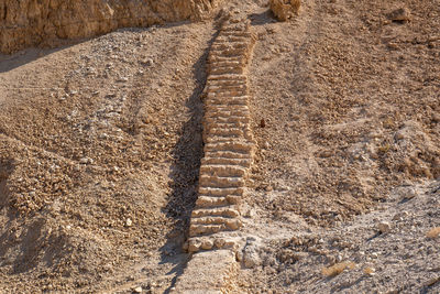 High angle view of tire tracks on road